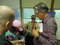 W0AIH showing QSL cards to scouts